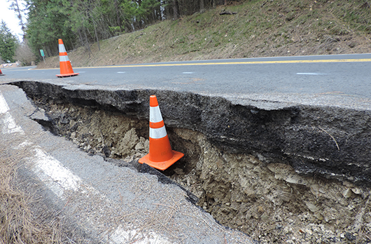 Slide damage at ID-97 at milepost 76.9 from April 2017.