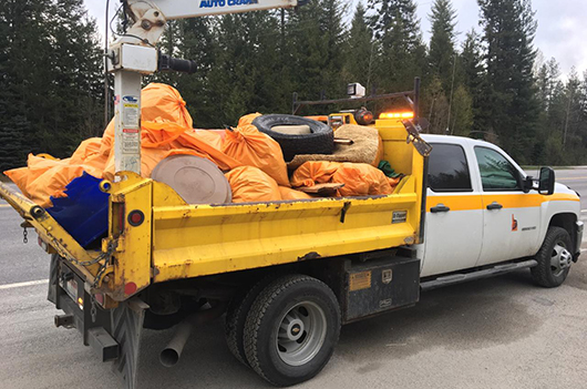 ITD truck loaded with bags of trash from an Adopt a Highway pickup