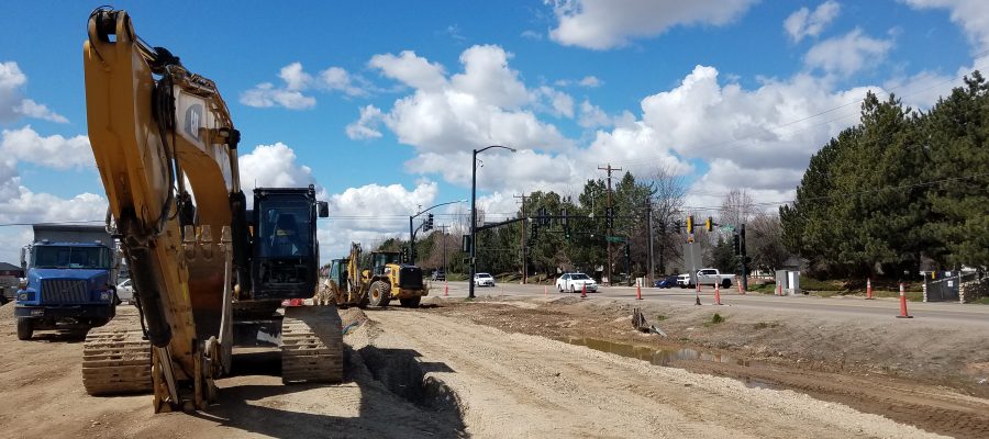 back hoe, loader, and semi truck near the intersection of Locust Grove and Chinden