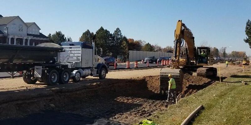 excavator besides roadway