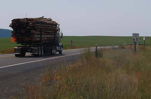Log truck at top of the grade on US-95