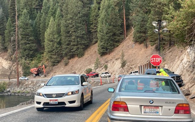 Cars stopped by flagger on Idaho Highway 55