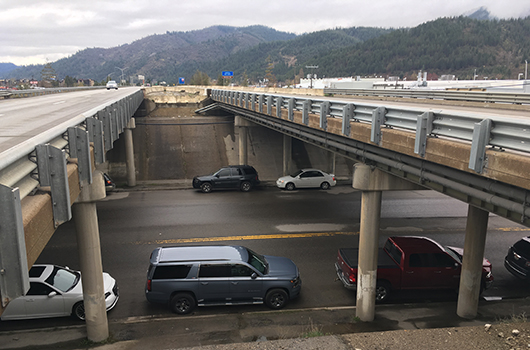 Traffic passes underneath I-90 on Division Street in Kellogg