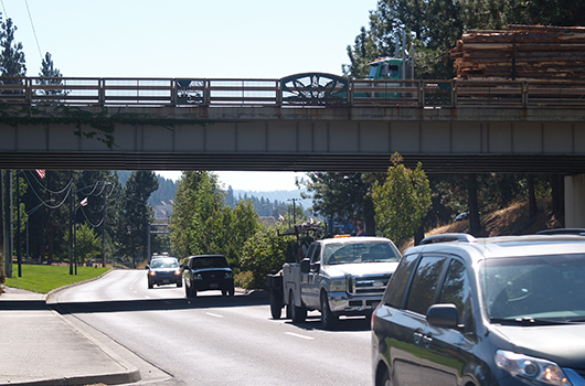Cars pass underneath US-95 on Northwest Boulevard in CDA