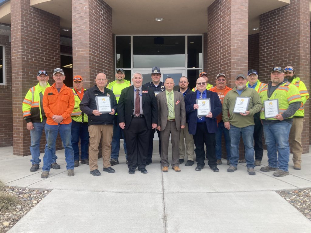 Photo of award recipients and ITD management