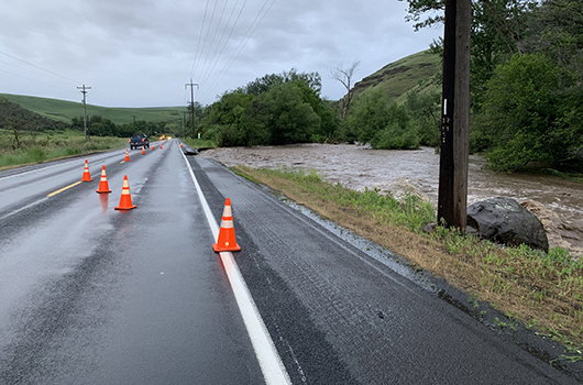 Flooding washes away shoulder on US-95 and closes a lane