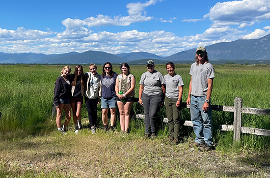 Volunteer group standing at the McArthur Lake Refuge